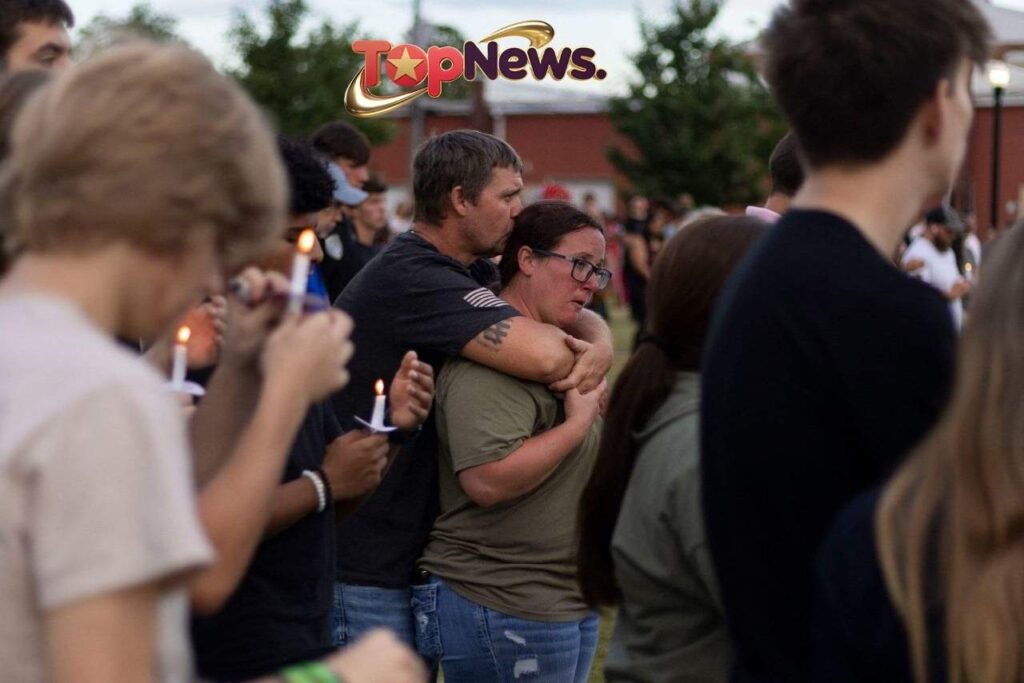 Couple Embraces During Apalachee High School Vigil