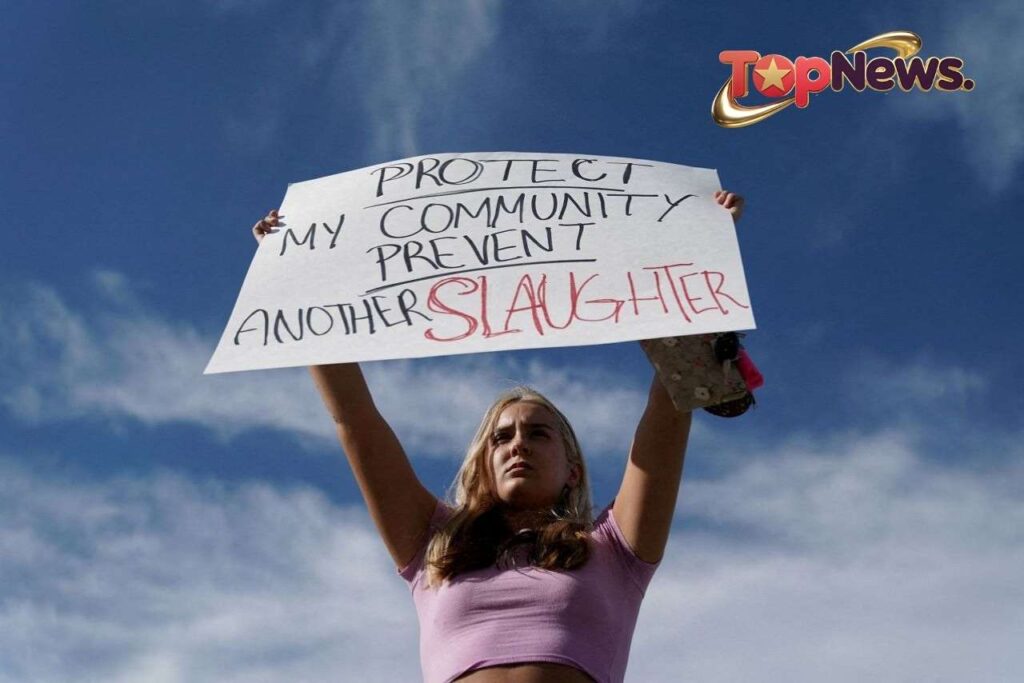Gretchen Gierlach Holds Sign After Shooting